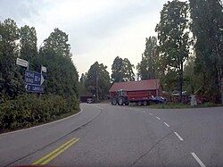 At the intersection of the roads leading to Lahnus and Ring III in the middle of Röylä