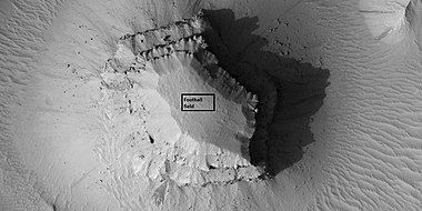 Close view of layered small mesa with dark slope streak, as seen by HiRISE under HiWish program. Box shows the size of a football field.