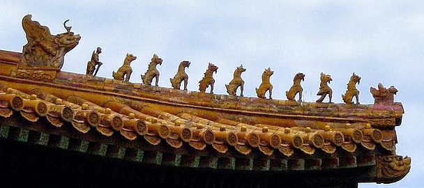 Ceramic figures decorating the Hall of Supreme Harmony at the Imperial Palace Museum. The 9 mystical beasts indicate the highest status in the empire for this building. Picture taken late September 2002 by Leonard G