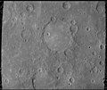 The Schubert basin, 190 km (120 mi) in diameter, filled by smooth plains. The basin's hummocky rim is partly degraded and cratered by later events.