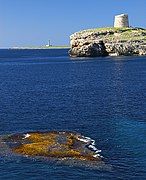 Martello tower, Alcaufar with Illa de l'aire lighthouse in the distance.