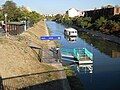 The Dacia station with a waterbus on the downstream direction, preparing to moor to the floating dock