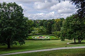 grassy hillside with garden planted in shape of maple leaf