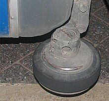 A small horizontal wheel attached to a bus