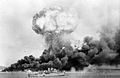 Image 12An oil storage tank explodes during the first Japanese air raid on Darwin on 19 February 1942 (from Military history of Australia during World War II)