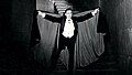 Bela Lugosi as seen in Dracula (1931) sporting a cape.