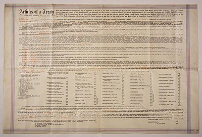 A large piece of parchment paper on which is written the terms of Treaty 7.