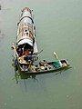 Poyang Lake fisherman who lives and feeds himself on a small fishing boat all year round