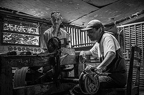 The stage of winding the weaving threads into a place where the spools of thread function as thread for the length of the songket cloth in Sumatra.