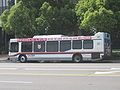 An OCTA bus at a stop on La Veta Avenue.