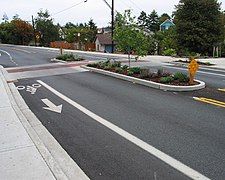 Median island with a raised mid-block pedestrian crossing