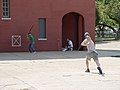 Image 38Stickball is a common street variant of baseball which often features impromptu adaptations. (Note the painted strike zone on the wall behind the batter.) (from Baseball)