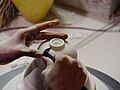 Hand crafting pottery in Bat Trang, Vietnam