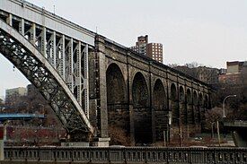 The transition from the steel arch over the Harlem River to the stone arches over the Major Deegan Expressway