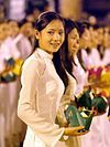 A girl wearing an Ao dai. For a time condemned as decadent by the country's rulers, the dress experienced a revival in the 1990s and is once again considered a national costume.