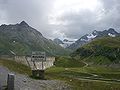 Bielerhöhe signpost approaching from the west with the dam in the background under which is the old high point of the pass.