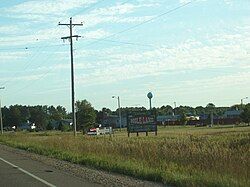 Welcome sign and houses in Mole Lake