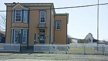 The O'Reilly House with St. Luke's Cultural Heritage Centre in the background.