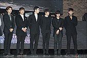 2PM standing in black suits