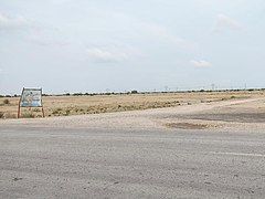 Road branching off the Indus Highway towards the town.