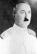 black and white portrait of a dark-haired man wearing dress uniform