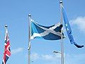 The Flag of the United Kingdom, Flag of Scotland and Flag of Europe at the Scottish Parliament Building.