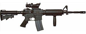 A M4A1 with SOPMOD package, including Rail Interface System (RIS) and Trijicon ACOG 4x.