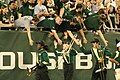 HOT members shake hands with fellow students after halftime.