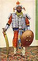 Photograph (hand-coloured), original dated 1898, of the high executioner of the former princely state of Rewah, central India, with large Tegha sword.