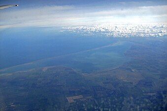 Aerial photo of Arabat Spit with the Syvash and Crimea in the foreground and the Black Sea in the background