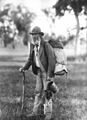 Image 27A swagman in bushman's apparel, wearing a brimmed hat and carrying swag and billy can (from Culture of Australia)