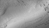 Reynolds crater showing streaks from defrosting, as seen by CTX camera (on Mars Reconnaissance Orbiter). Layers are also visible. Note: this is an enlargement of the previous image of Reynolds crater. Streaks are caused by pressurized carbon dioxide blowing out dust that is blown by the wind into streaks.