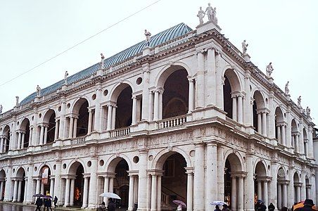 The Basilica Palladiana, Vicenza, (begun 1546) with arched Palladian window and round oculi to the loggia.