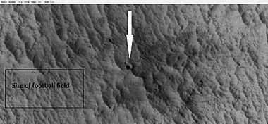 New crater, as seen by HiRISE under HiWish program. The new crater indicated with the white arrow is about 10 yards across and was probably created by the collision with an object the size of a large watermelon. This crater did not appear in earlier images of the same region.