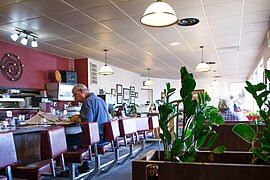 A lunch counter serving an older gentleman