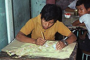 Painting the Wayang Kulit in a Yogyakarta factory