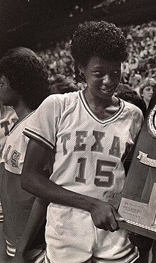 Annette Smith holding the National Championship trophy with Head Coach Jody Conradt