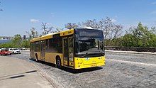 Black-and-yellow bus in traffic