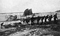 New Zealand Flying School staff and students hauling up the Caudron float plane. Kohimarama, 1916