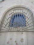 Barclays Bank logo (BB) under a window (southeast facade)