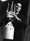 Joe Shea holding a model of the lunar module