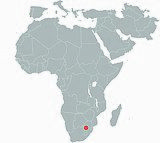 A map of the African continent with a red dot indicating the Cradle of Humankind in the northeast region of South Africa