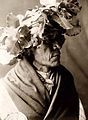 Cheyenne man wearing a wreath of cottonwood leaves