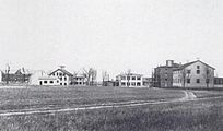 Groveland Shaker Village, New York., 1890s. The photograph includes an 1842 meetinghouse (right), shops, and a four-story, late 1850s brick East Family building. New York State Museum, Albany.