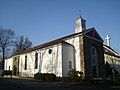 The original Saint Thomas More Catholic Church in Lake Ariel, the new church is in the background