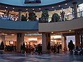 The centre court and food court of Chinook Centre before renovations from the lower level on July 23, 2006, showing Club Monaco, Yogen Fruz, and an HMV (closed) poster.