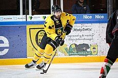 Carl Hudson playing ice hockey for GKS Katowice