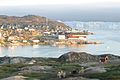 Ilulissat, old part of the city with icebergs from the Ilulissat Icefjord in the background