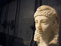 Possible sculpted head of Cleopatra VII wearing an Egyptian-style vulture headdress, discovered in Rome, either Roman or Hellenistic Egyptian art, Parian marble, 1st century BC, from the Capitoline Museums[435][436]