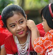 Tripuri children prepare for a dance in India's northeastern Tripura state. The Tripuri, an ethnic group which speaks a Tibeto-Burman language, forms 30% of the state's population.[5]